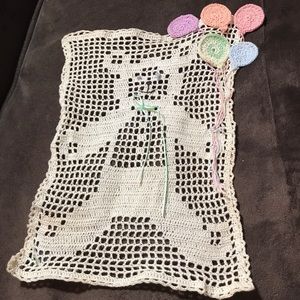 Crocheted picture of teddy bear holding balloons. Handcrafted estate sale find.